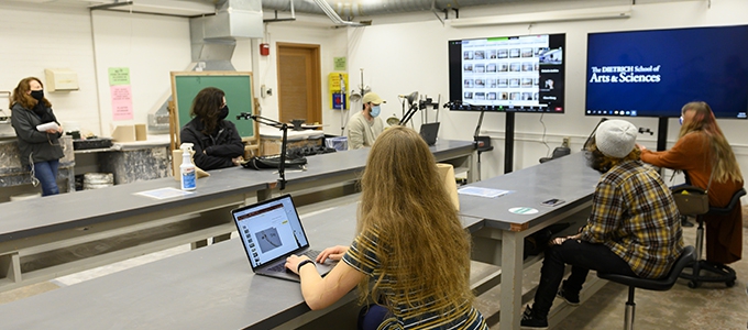 students socially distanced in studio arts classroom